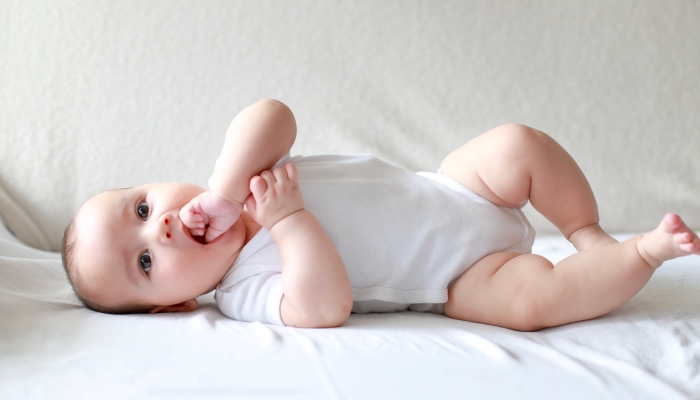 baby,newborn,boy,sucking,finger.,mixed,race,asian german,infant,lying