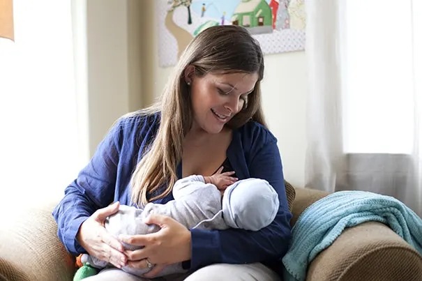 mother breastfeeding newborn